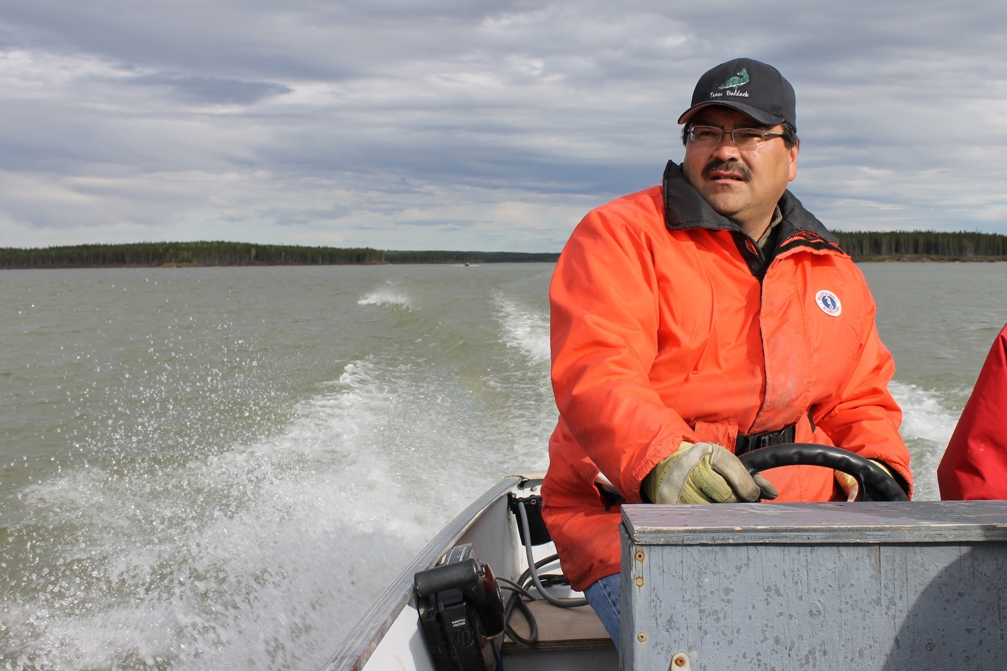 A man driving a boat