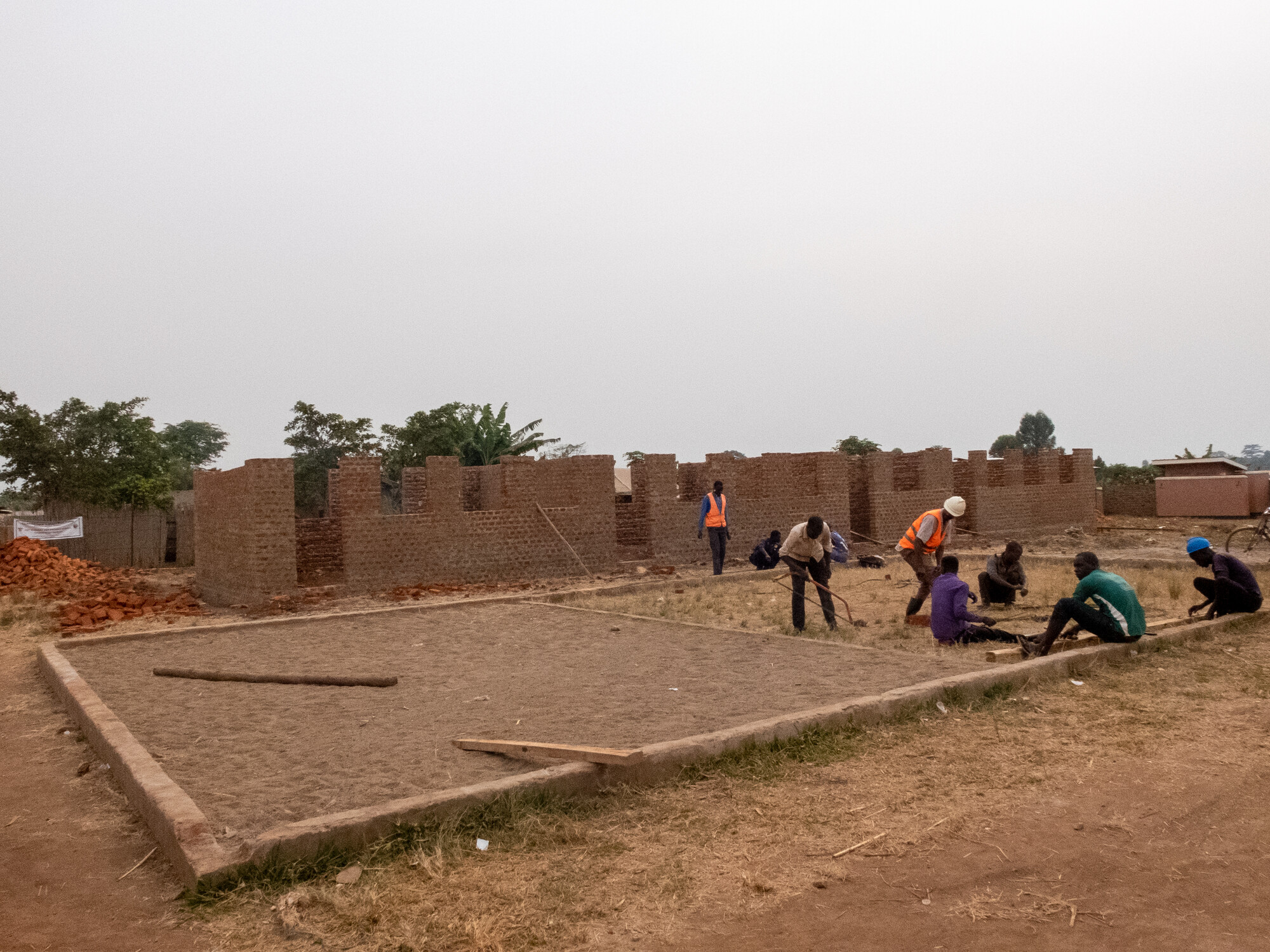 Construction workers work the ground for a future playground