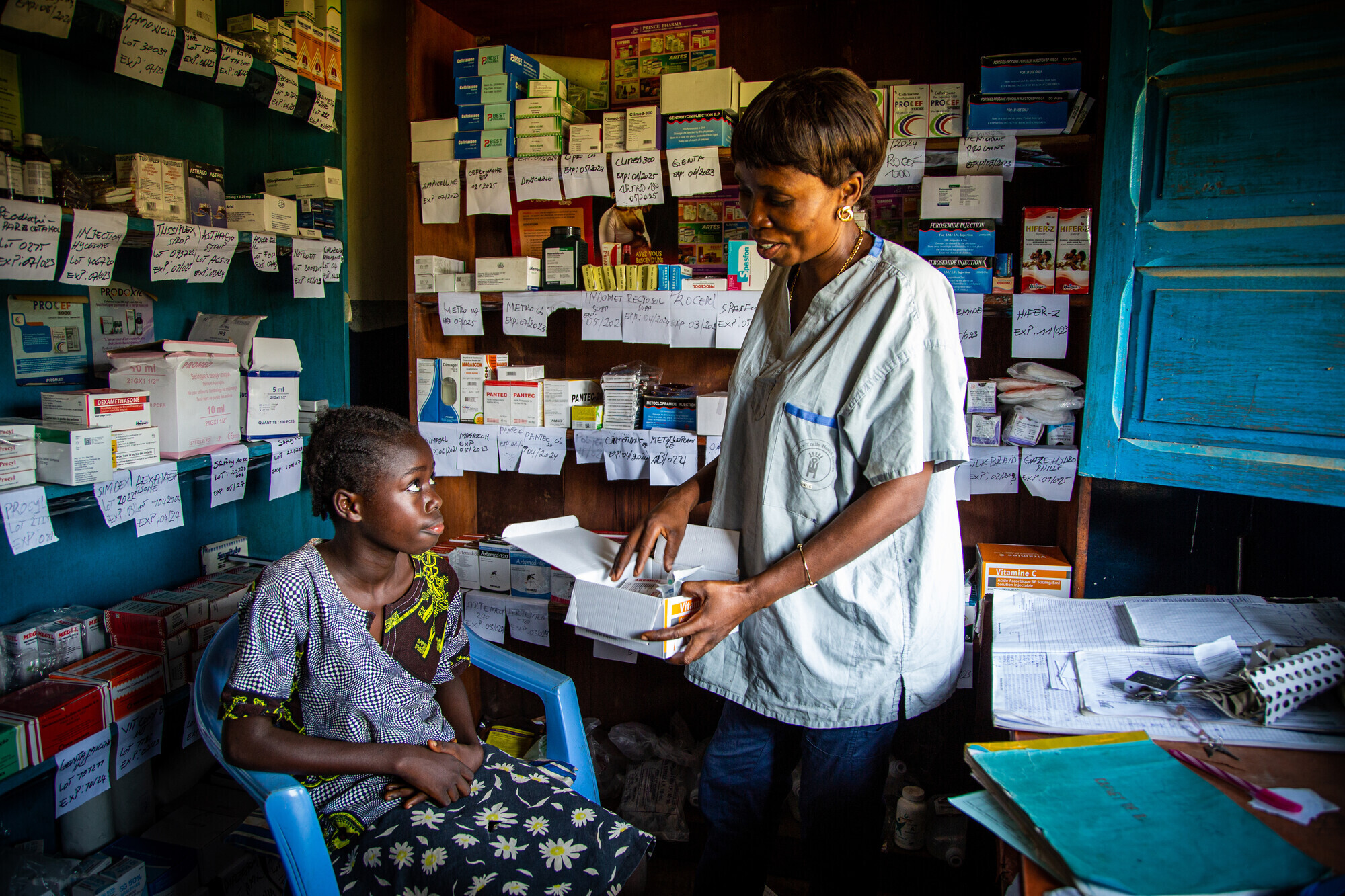 nurse giving medicine to a child