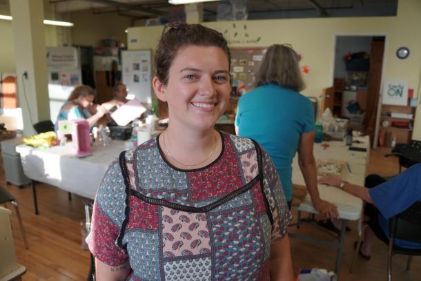 A woman with a quilt-patterned shirt