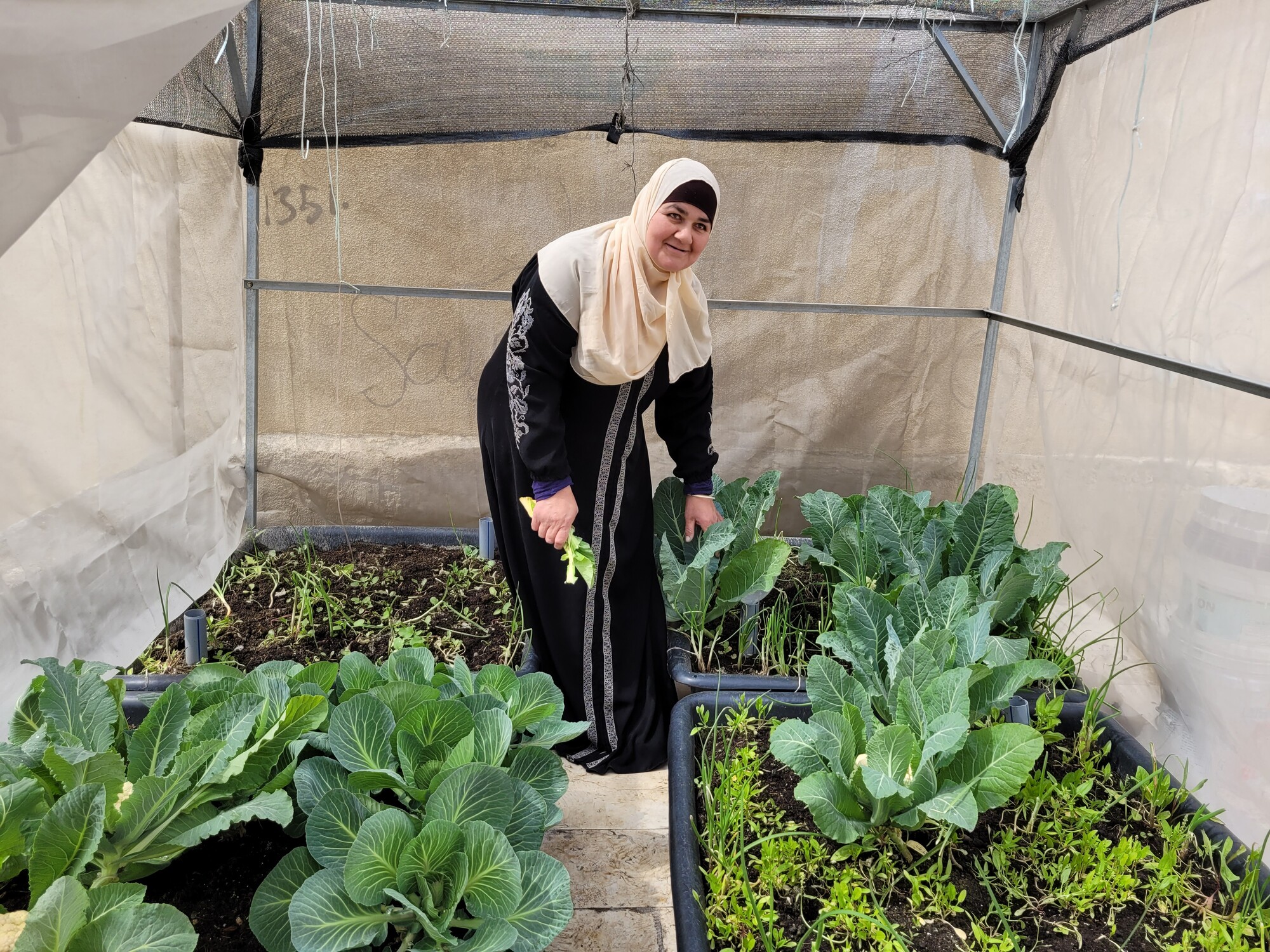 Woman standing in her rooftop garden