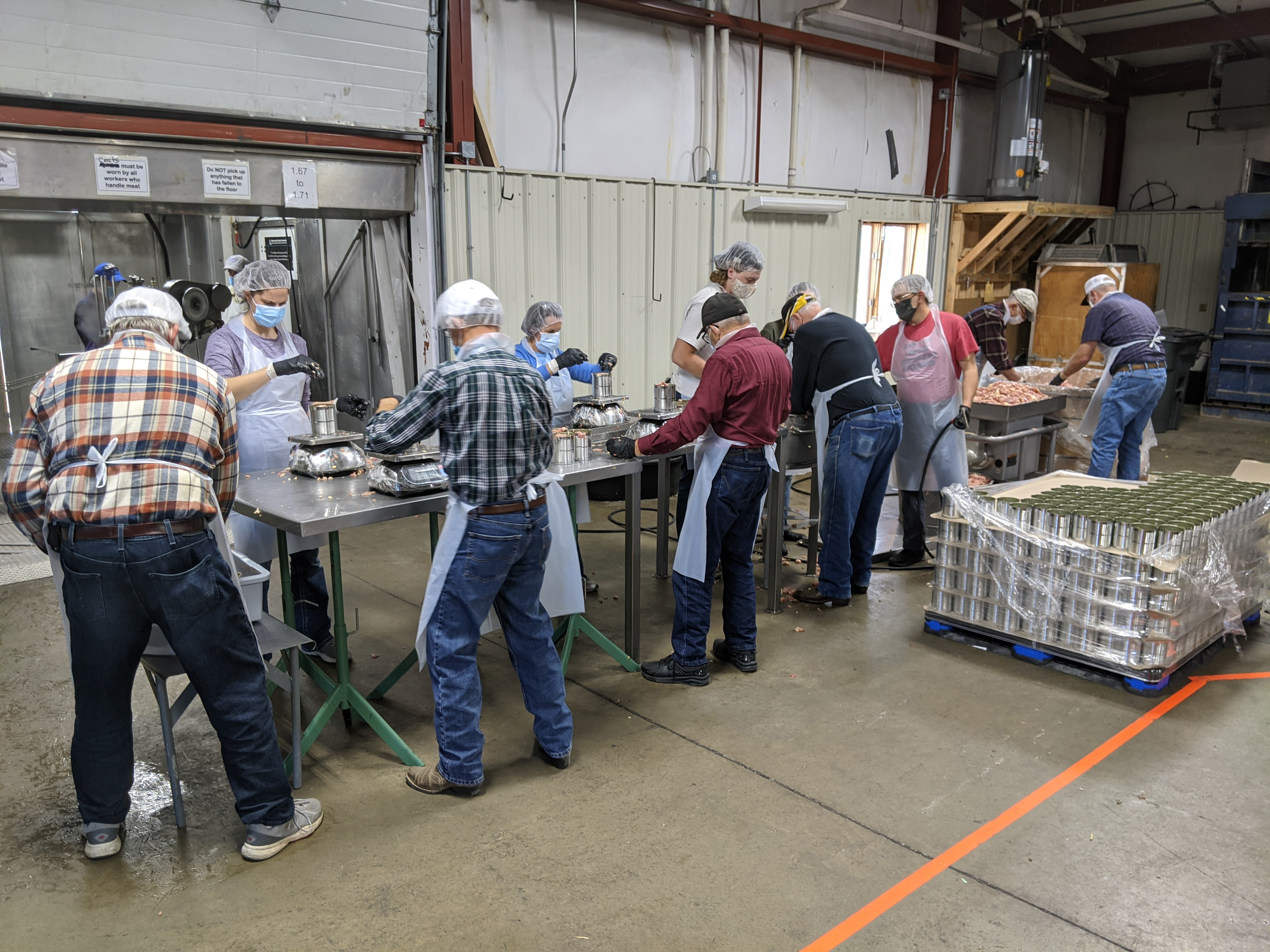 Volunteers can meat in a warehouse