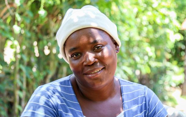 Guerres Lucien, outside her home in Lahoye, Haiti.