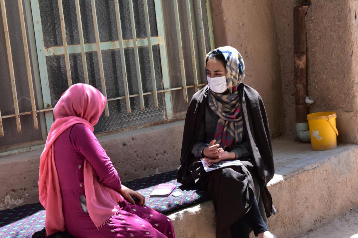 Two women sitting and talking