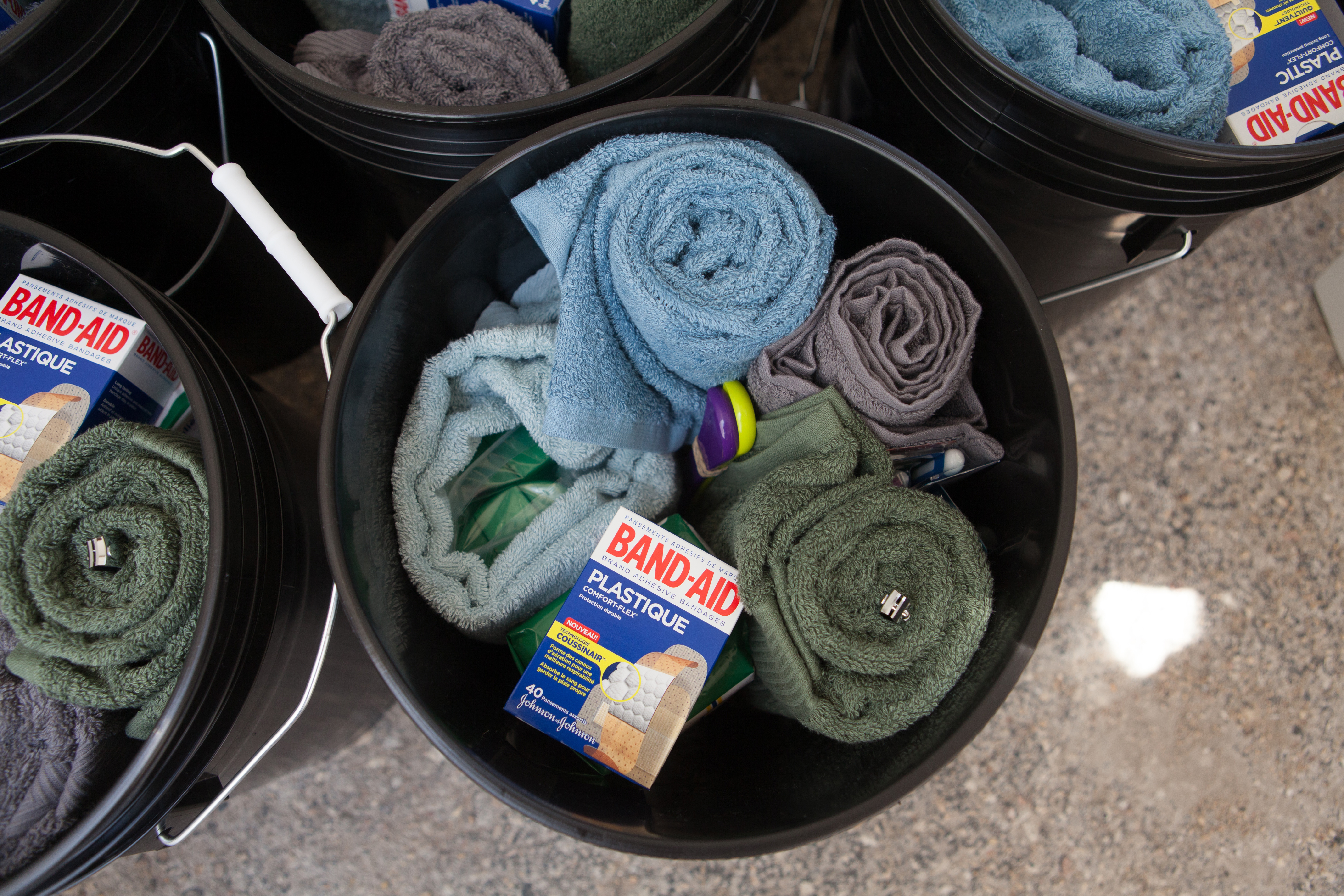 Five gallon buckets packed with hygiene supplies