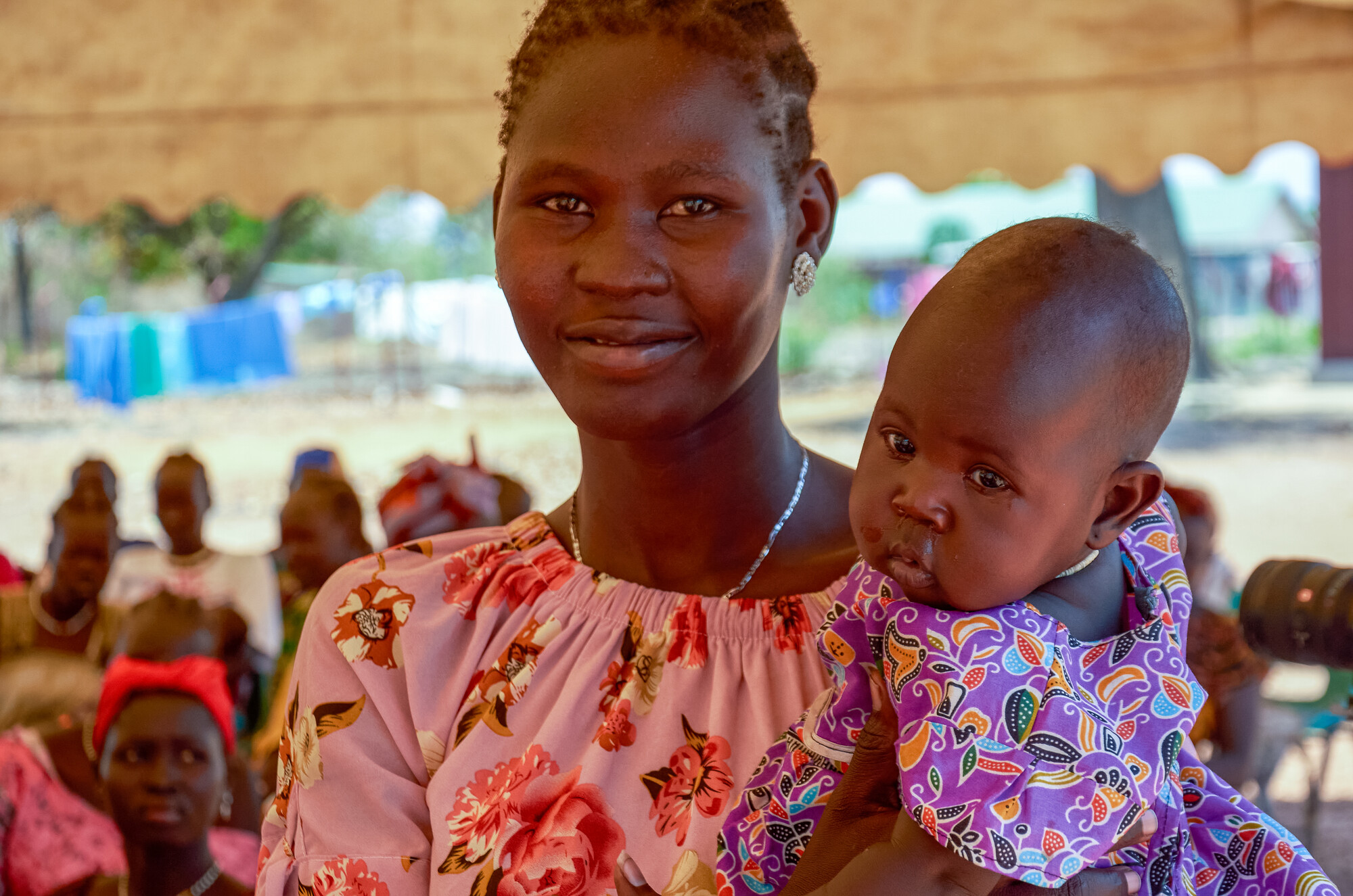 A woman holding an infant