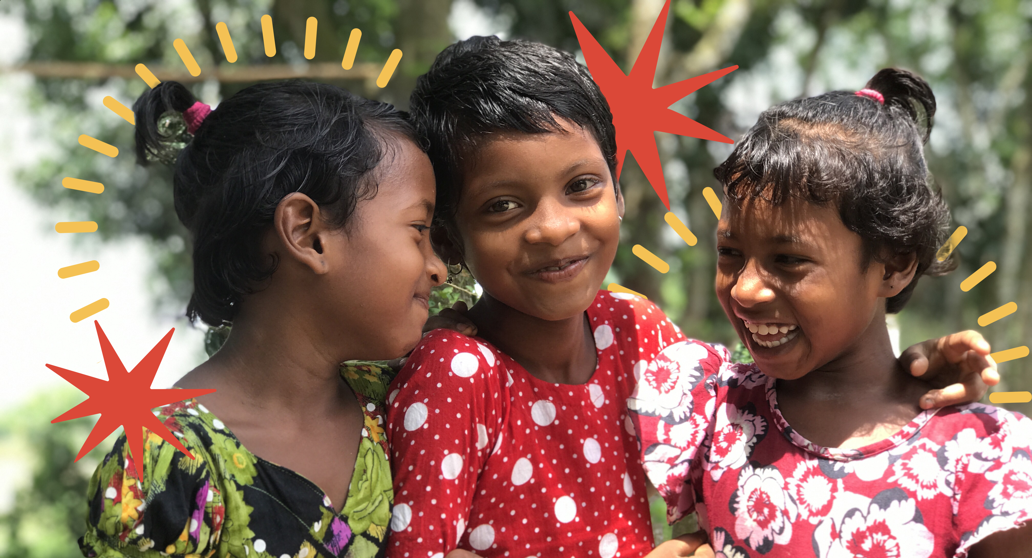 Three young girls smiling