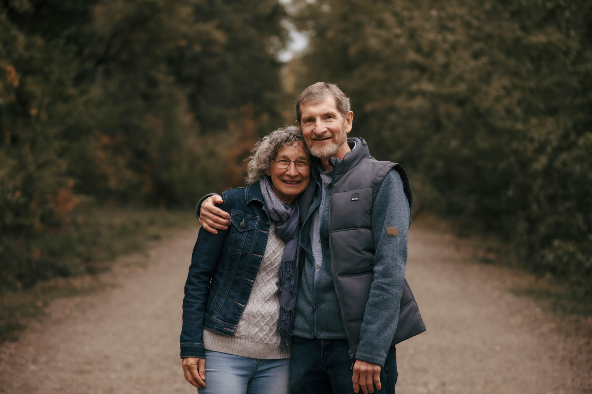 A photo of a couple smiling for a photo