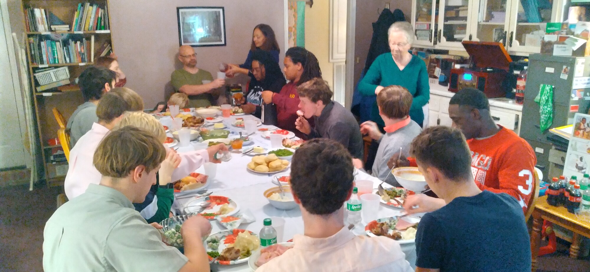 A group of people sitting around a dinner table