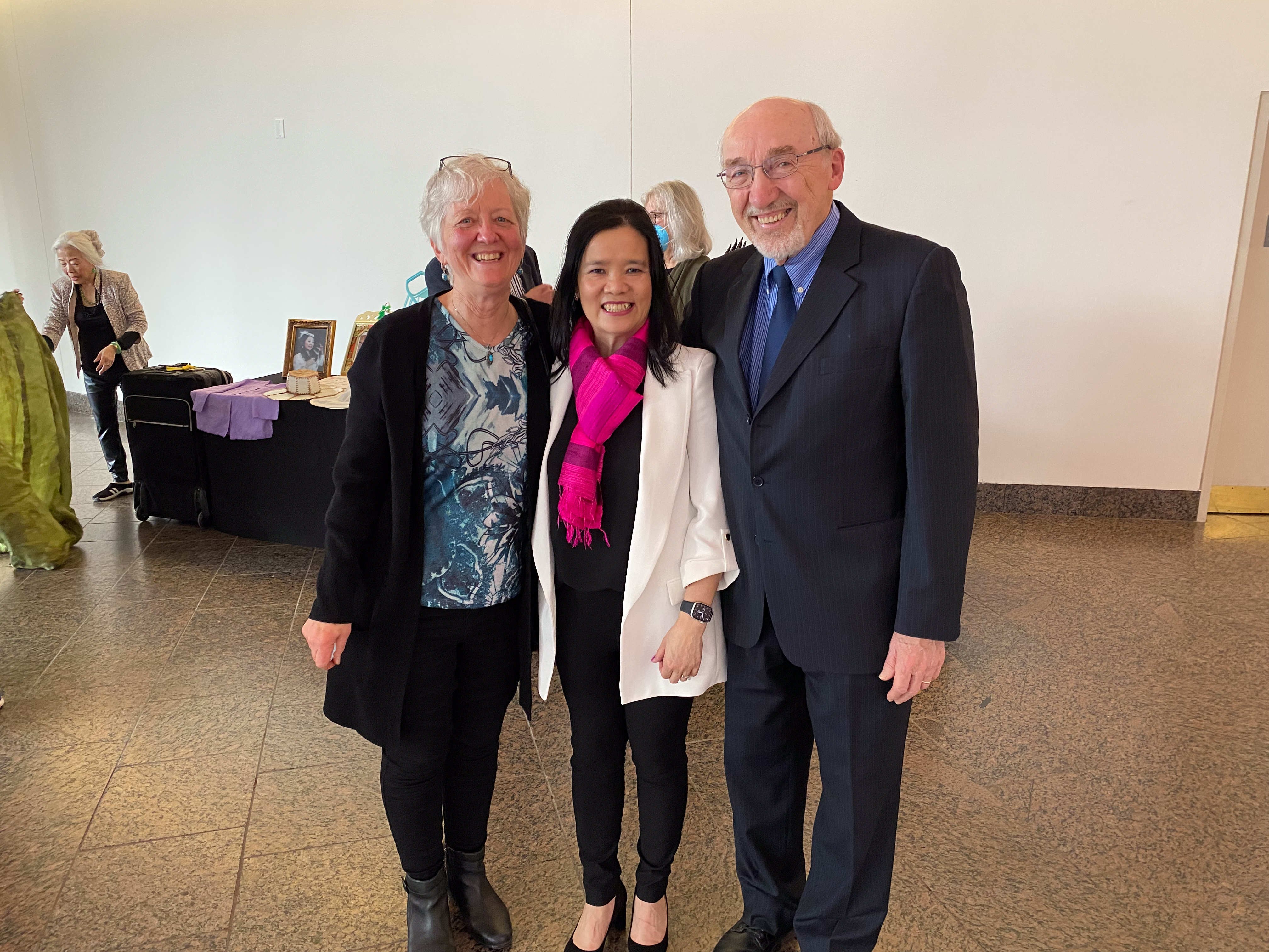 Three people pose for a photo