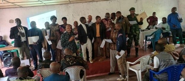 Dr. Mulanda Jimmy Juma is pictured with participants of the mediation process in Democratic Republic of the Congo.