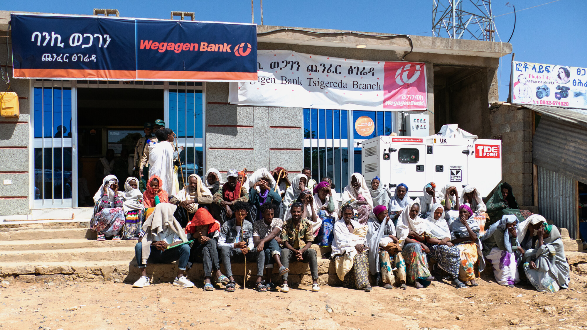 A crowd gathers to withdraw their cash transfers from a Wegagen Bank branch in the small town of Tsigereda. MCC photo/Paul Mosley