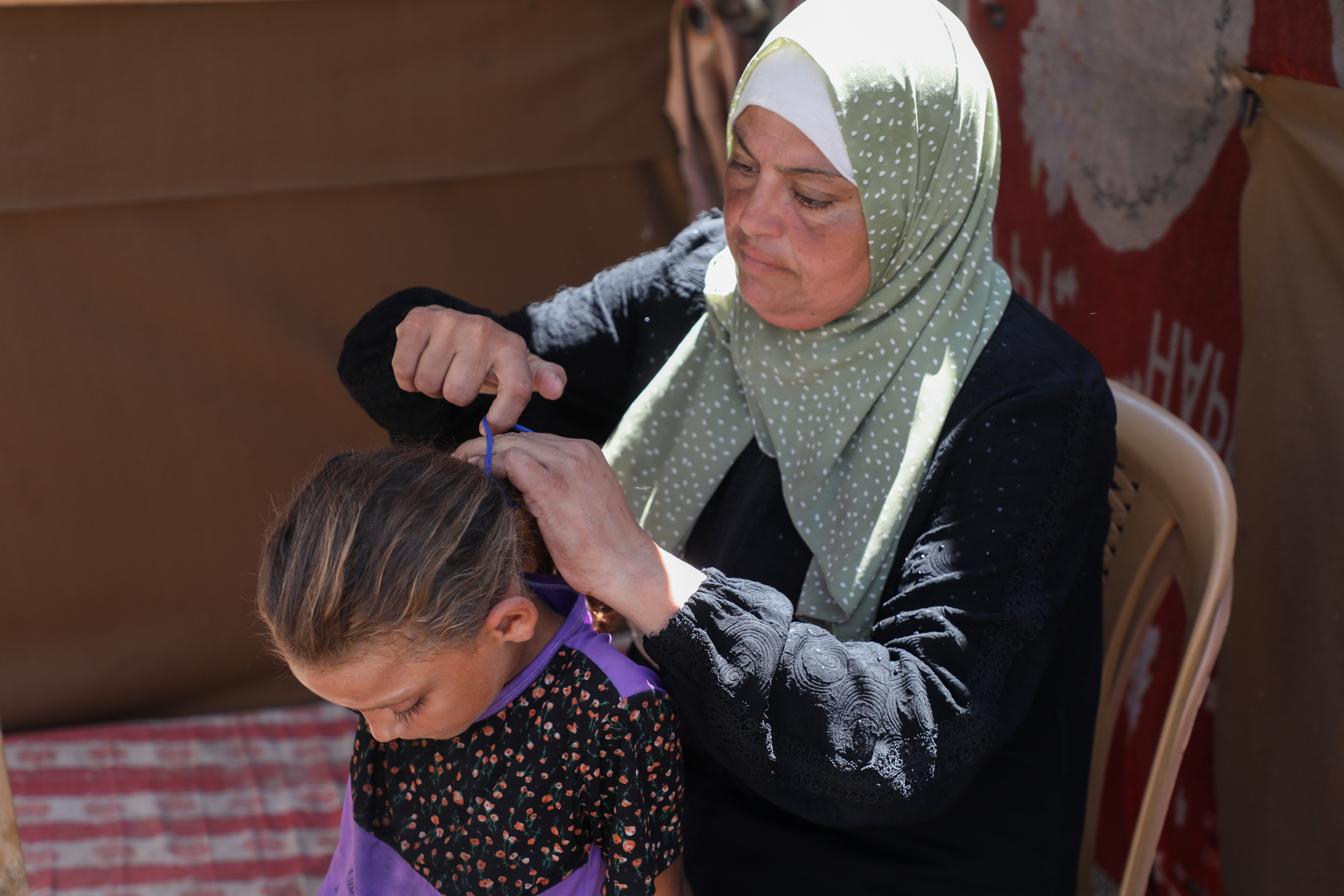 Woman combed child's hair