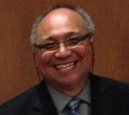 A man in glasses smiling