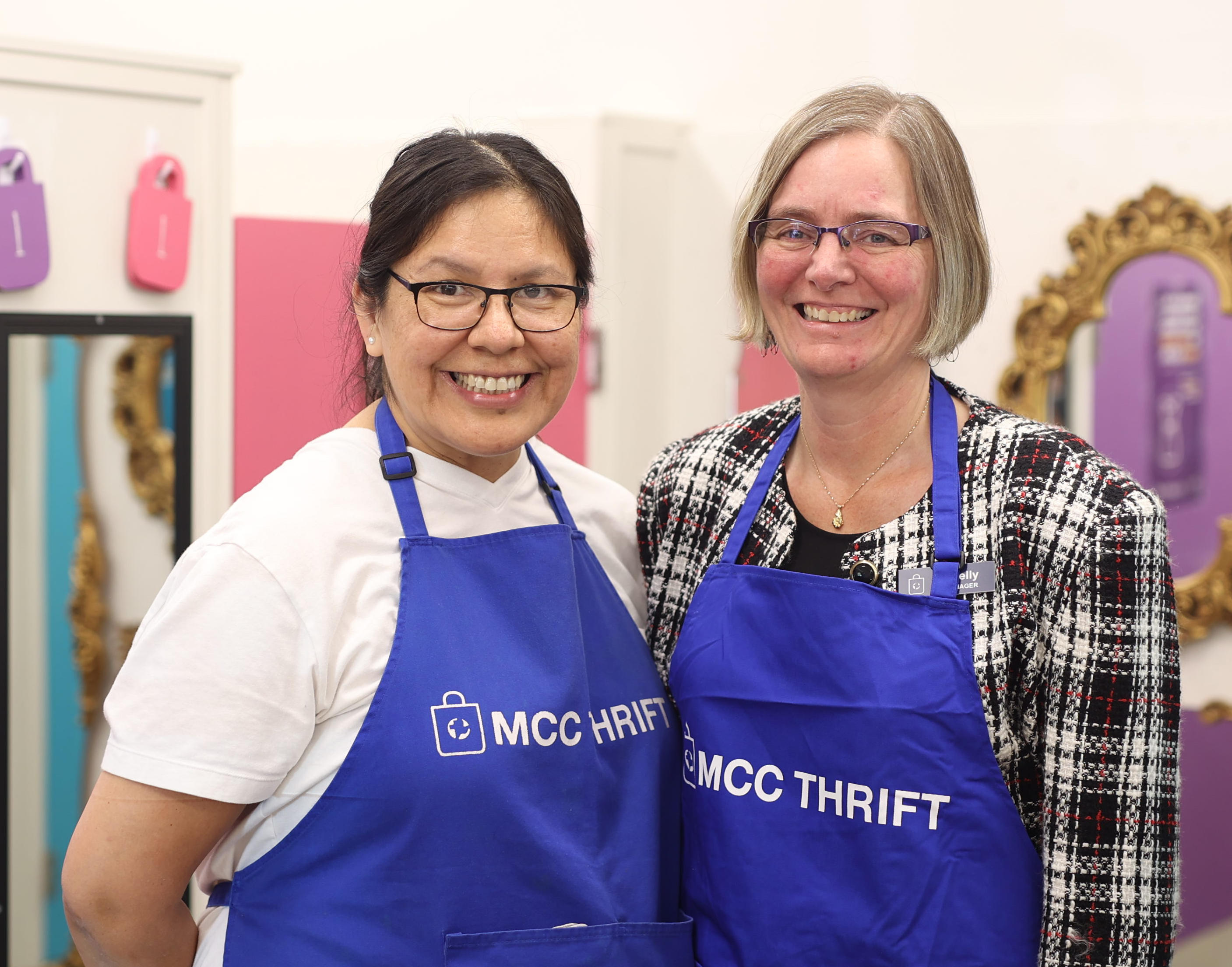 thrift staff and volunteer in thrift store