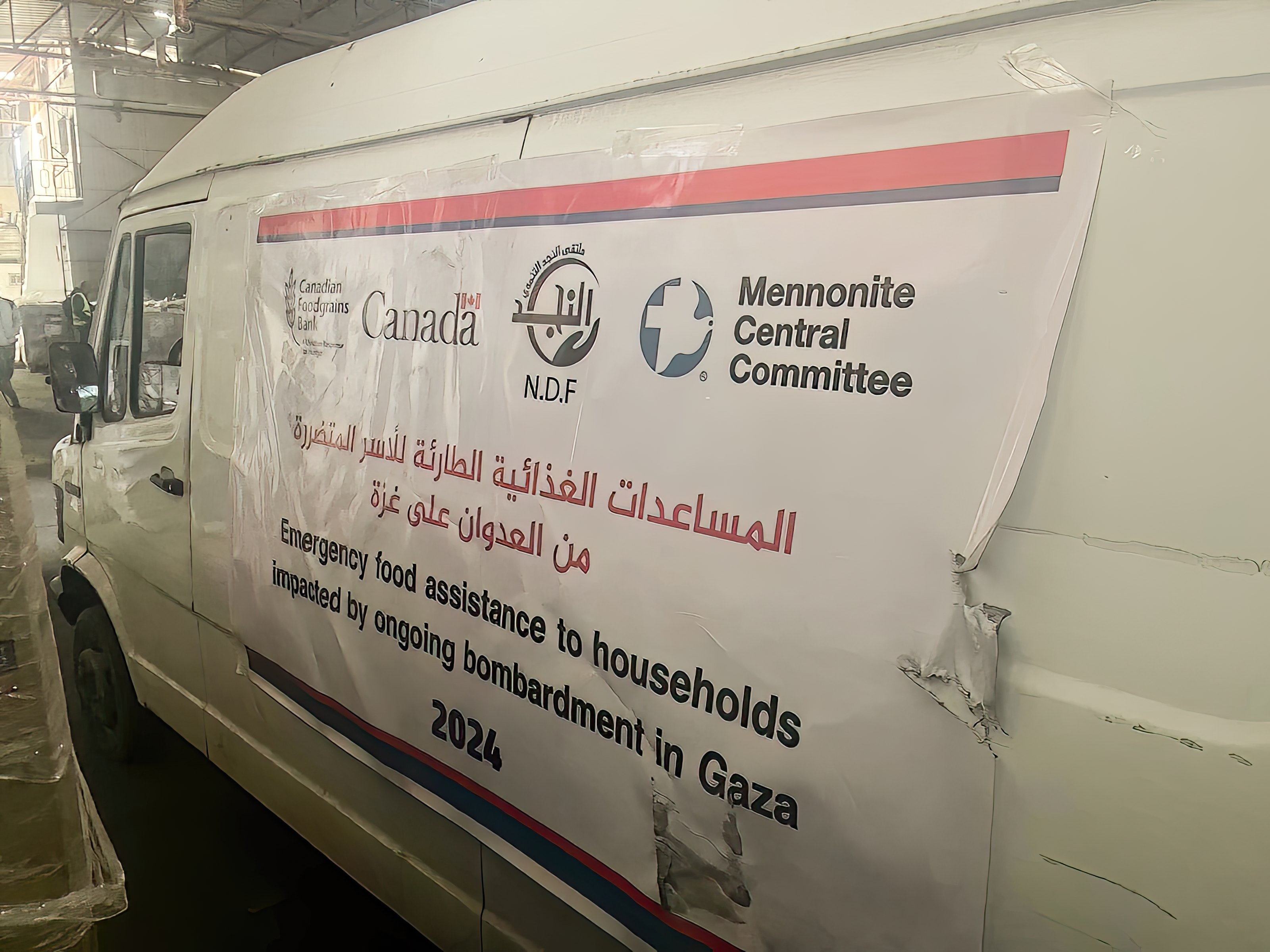 A van that will transport the emergency food that has arrived in Gaza for distribution to families in Deir al Balah and surrounding areas.