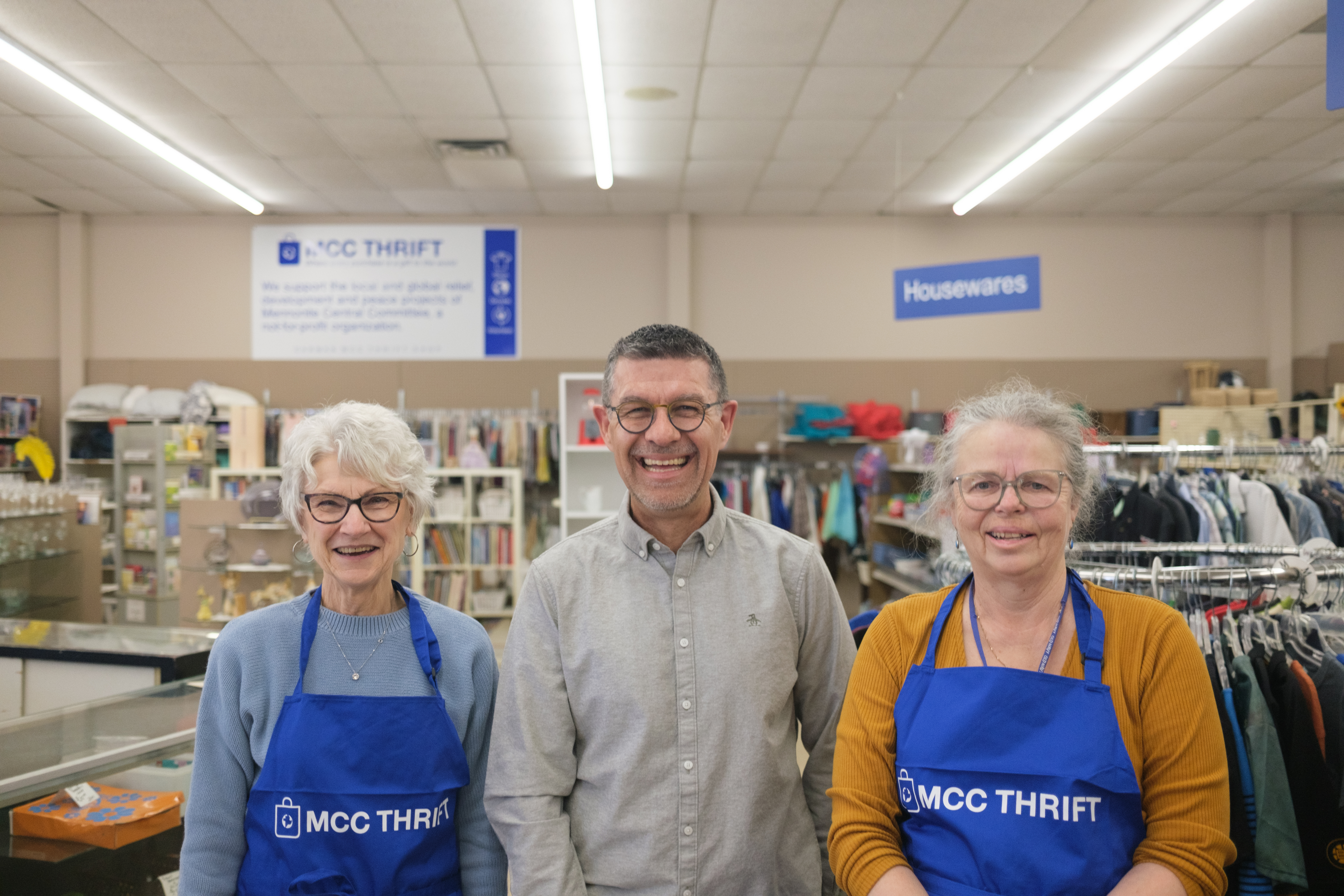 Mary Anne Falk, Konrad Loewen and Yvonne Jeffers in an MCC Thrift Shop