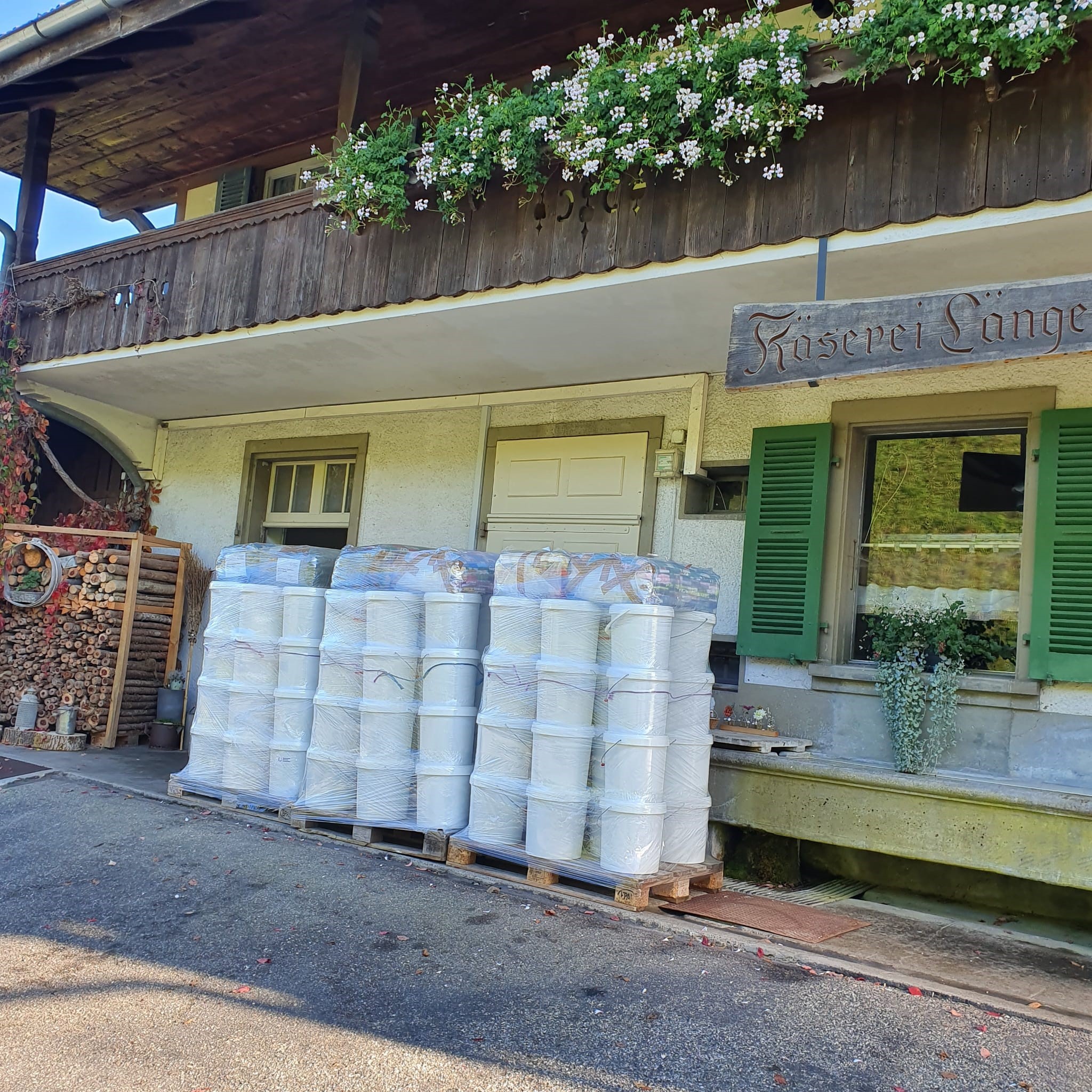 piles of oversize buckets in front of a cheese dairly