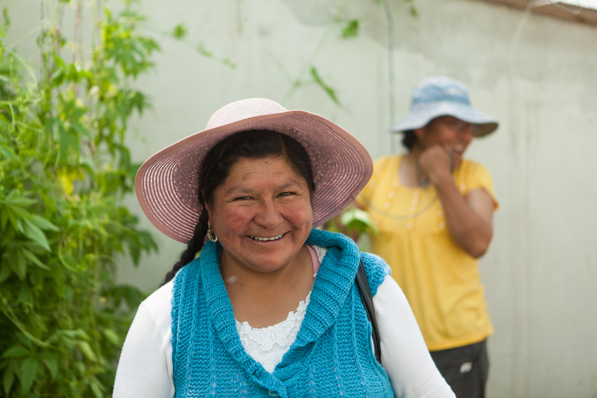 A woman smiles at the camera