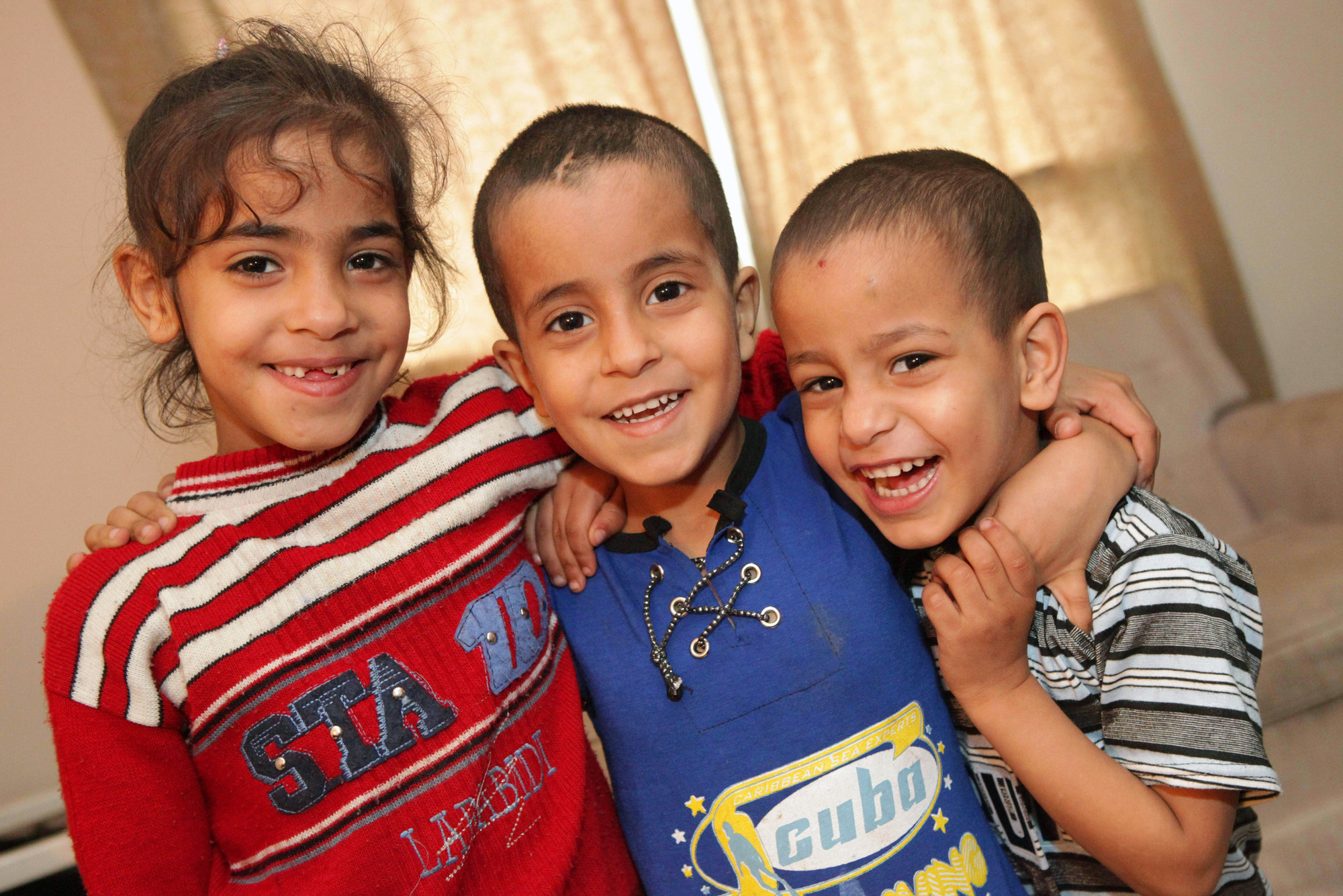 In August 2010, the Al Samaneh family including, from left, Khadijah (7), Yehia (6) and Bashar (5), arrived to their new home in Ontario. For more than three decades, MCC Canada's refugee assistance p