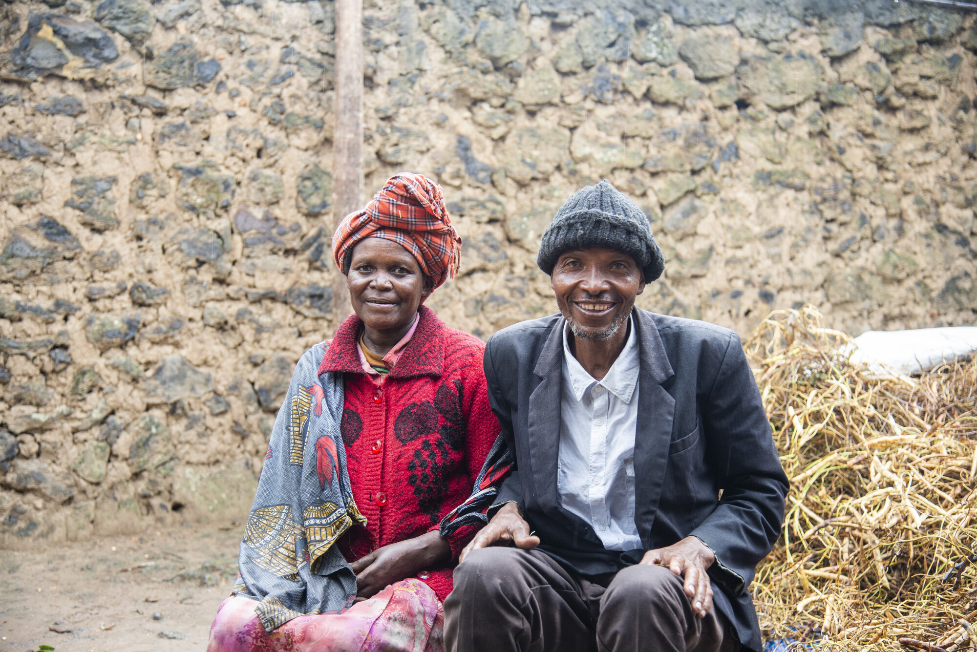 Verena Nyirantezimana, and her husband, farmer field school president Vincent Hategekimana, sit at their home in Rwanda’s Burera District. Money earned through participation in a savings group has e