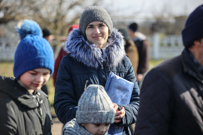 This family* in a village recovered from Russian military control in Ukraine's Kherson region received relief items from MCC partner Charitable Foundation Uman Help Center (Uman Help Center).

*The