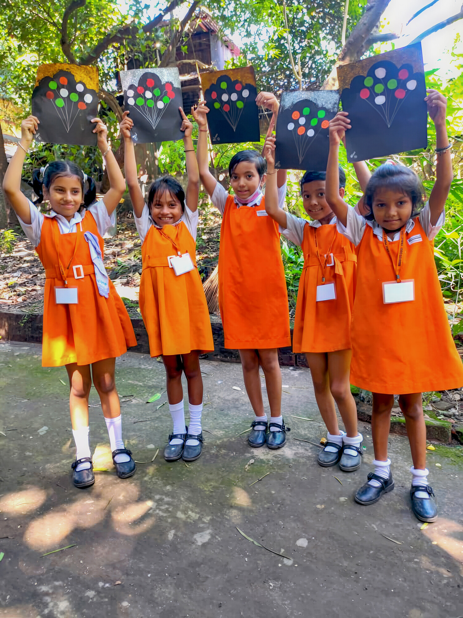 Children from Bani Pith Girls Primary School are eager to display their artwork.