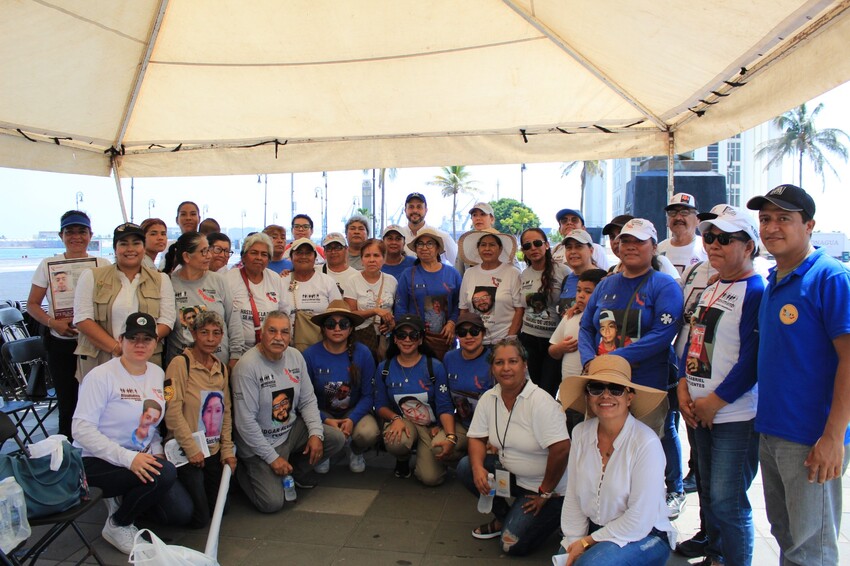 Relatives of disappeared people in Mexico gather in Veracruz, Mexico, for their annual Mother's Day march, holding banners and wearing shirts depicting their missing loved ones. After the march, relat