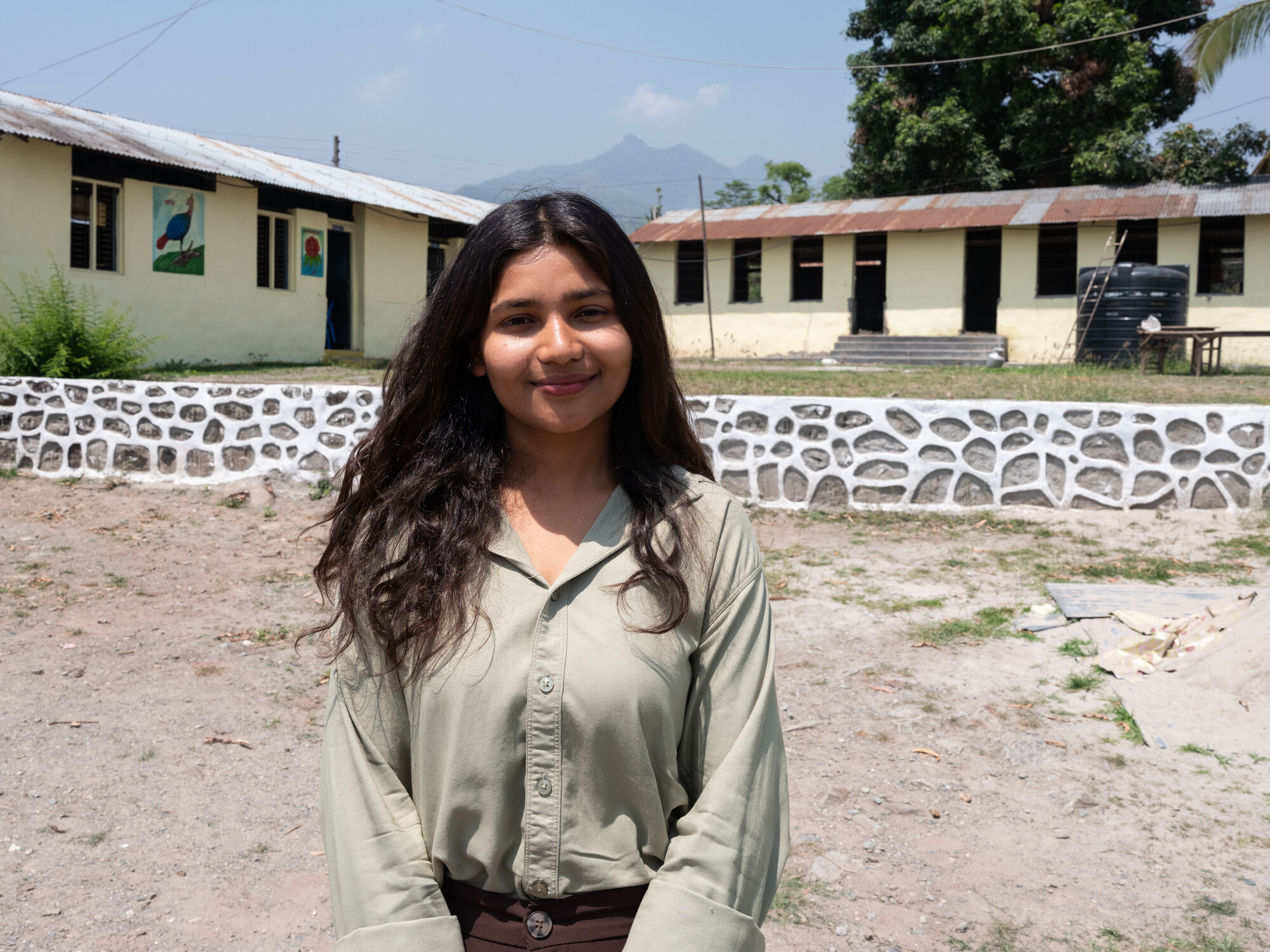 Mamata Parajuli (22) is at Shree Sabitri Secondary School, where the school installed electrical wire after participating in the awareness meeting organized by Mamata and her team to talk about the ri