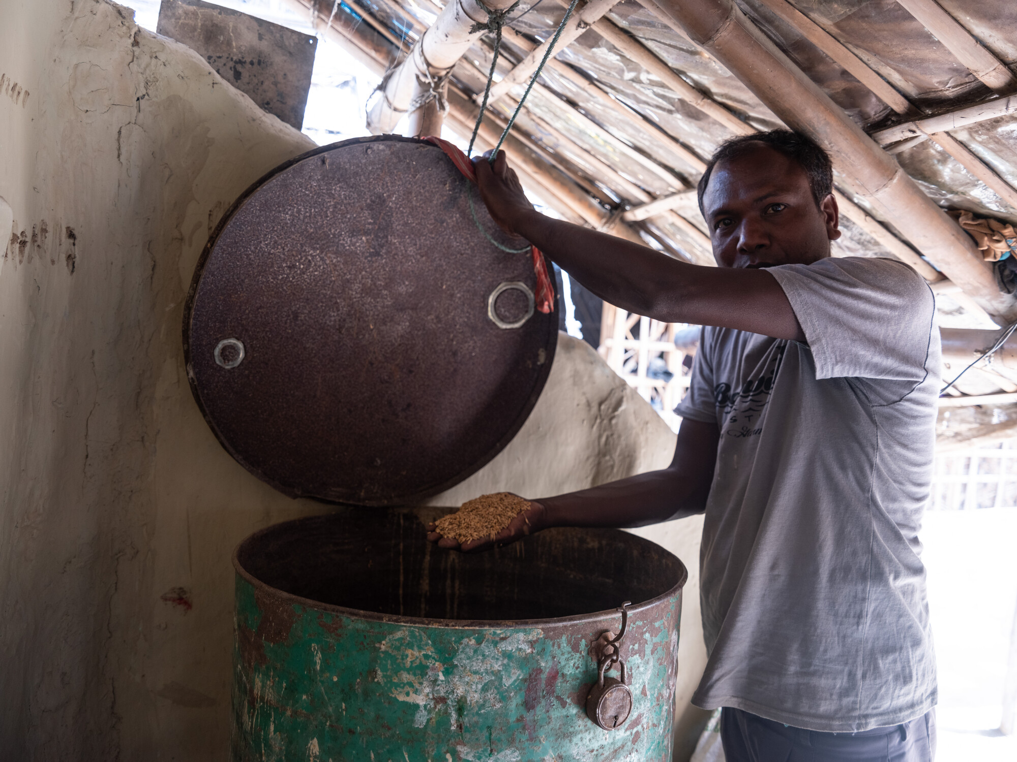 Shree Ram Mahato (42), a chairperson of  the Shree Ram Janaki farmers group, shows stored rice at his house in Jahada Rural Municipality- 5, Morang, Nepal on Wednesday, April 24, 2024. He received LIF