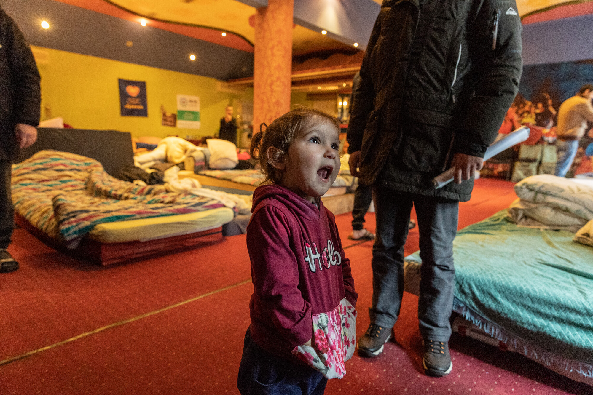 A child* who lives in a large room in the shelter run by Blaho Charitable Fund in Uzhhorod. This room used to be a restaurant in a hotel, but the building is now being rented by Blaho to provide tempo