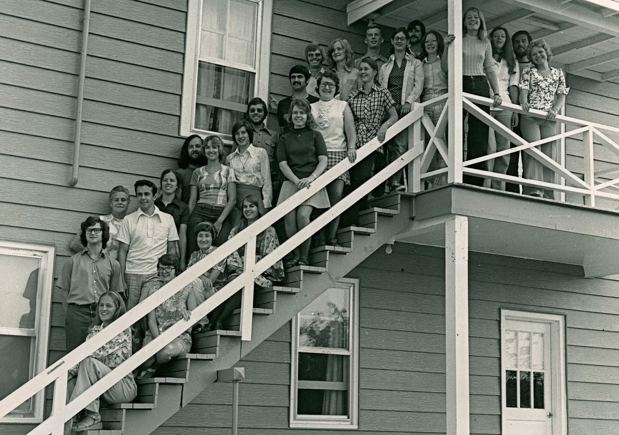 Participants in the August 1–9, 1974 orientation held at the MCC campus in Akron, Pennsylvania. 
Standing in the back: David Stoltzfus, Olga Rempel, Rea MacKey, Sarah Eby, Brian and Eileen Smucker,