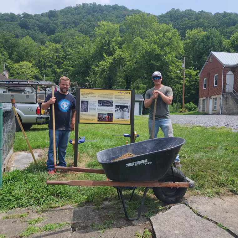 Historical marker and MCC staff working.