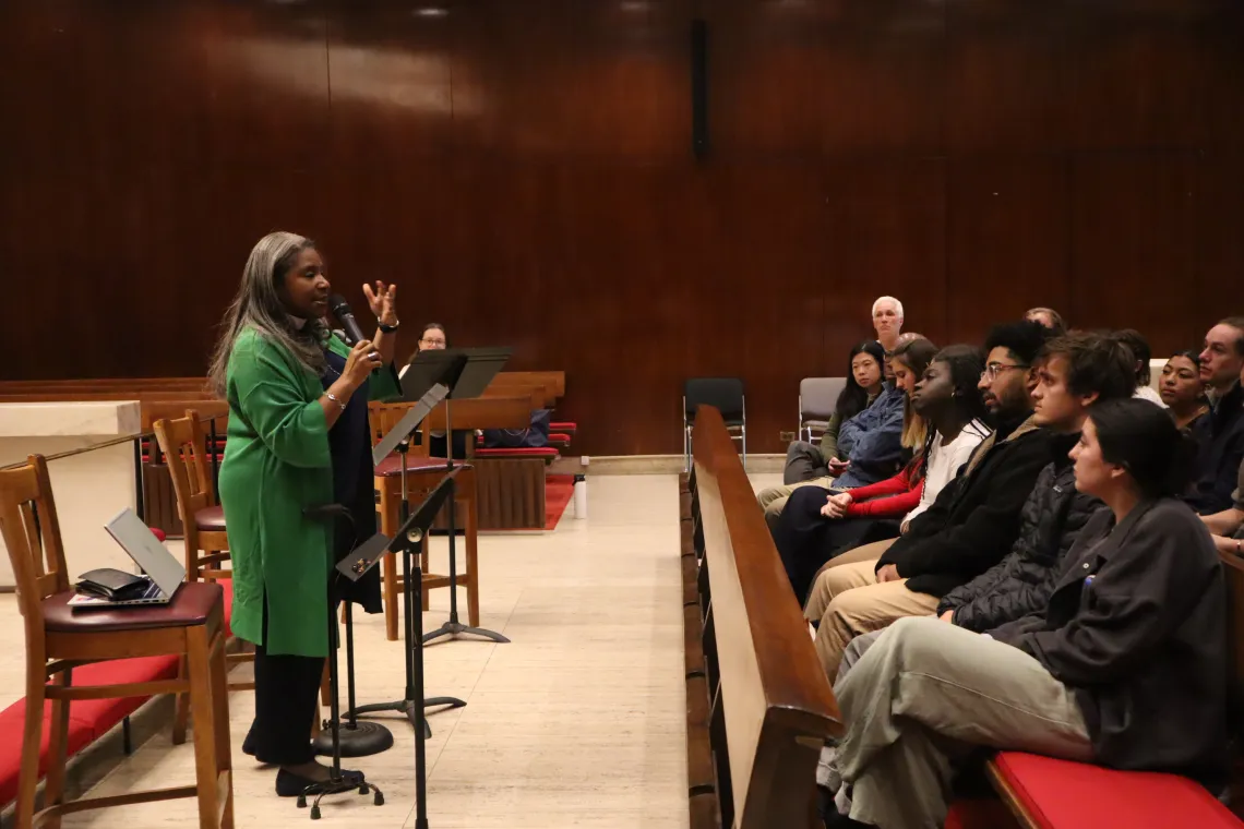 A woman leads a chapel. 