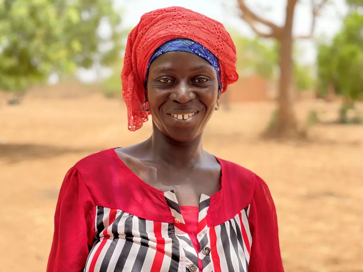 A portrait of a woman wearing red