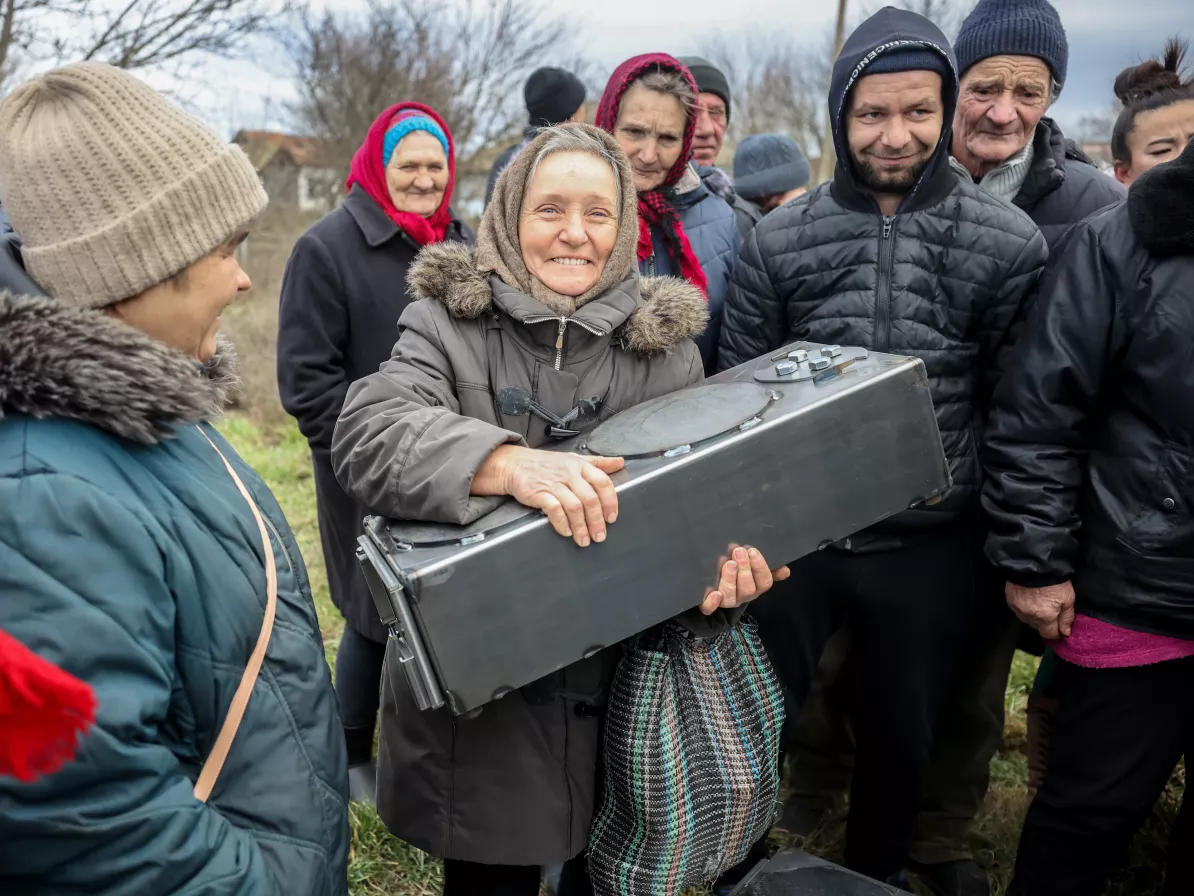 A woman receiving an MCC relief kit