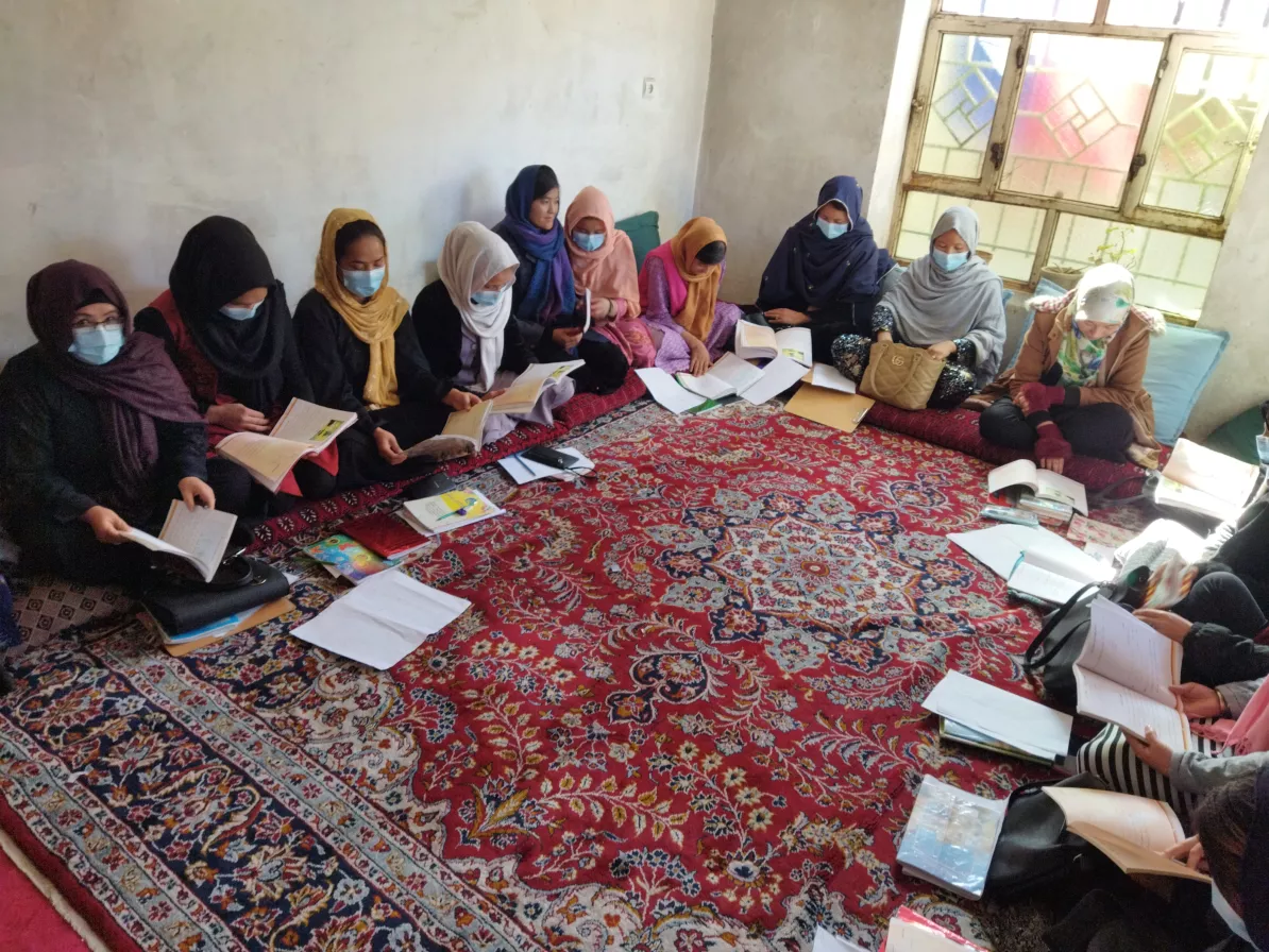 Group of women learning to read