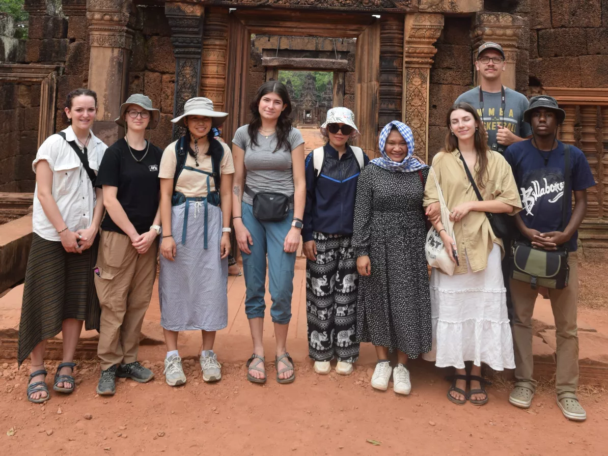 Madeline Simons (far left) and other members of the 2024 Seek cohort in front of the Banteay Srei temple in Siem Reap province during their term in Cambodia. (Photo courtesy of Madeline Simons)