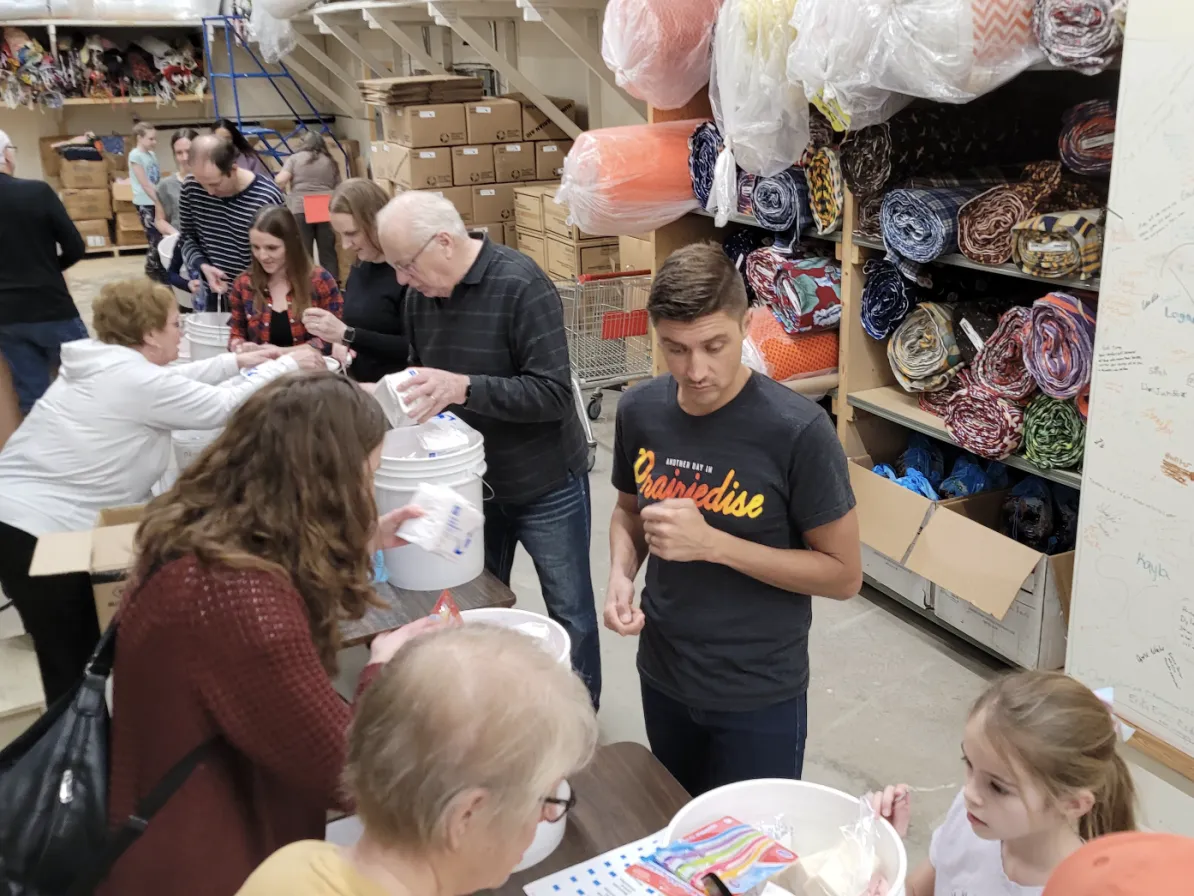 A group of people packing kits