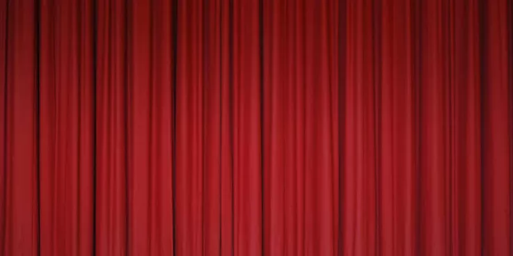 A red curtain as if on a performance stage.