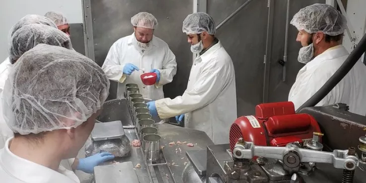 Caption: Volunteers in Newton, Kansas, put a teaspoon of salt in the cans before filling them with ground chicken. MCC photo/Josh Voth


More information: Volunteer groups representing Amish, Beach