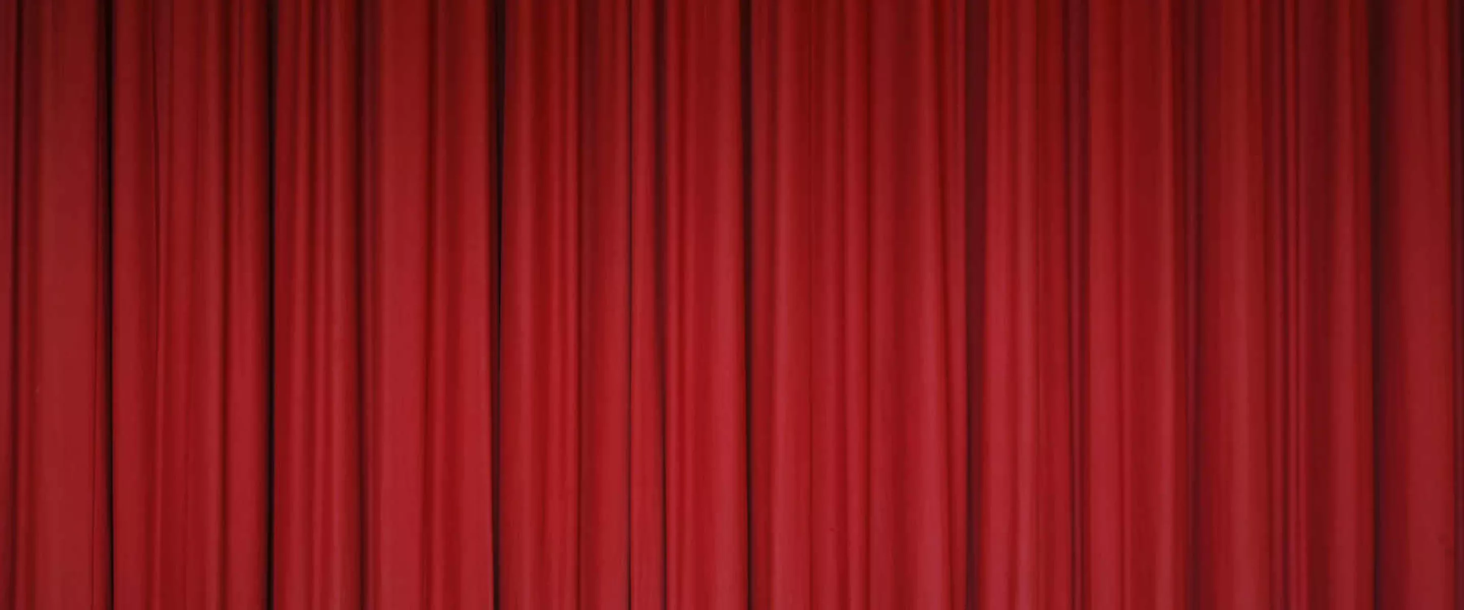 A red curtain as if on a performance stage.