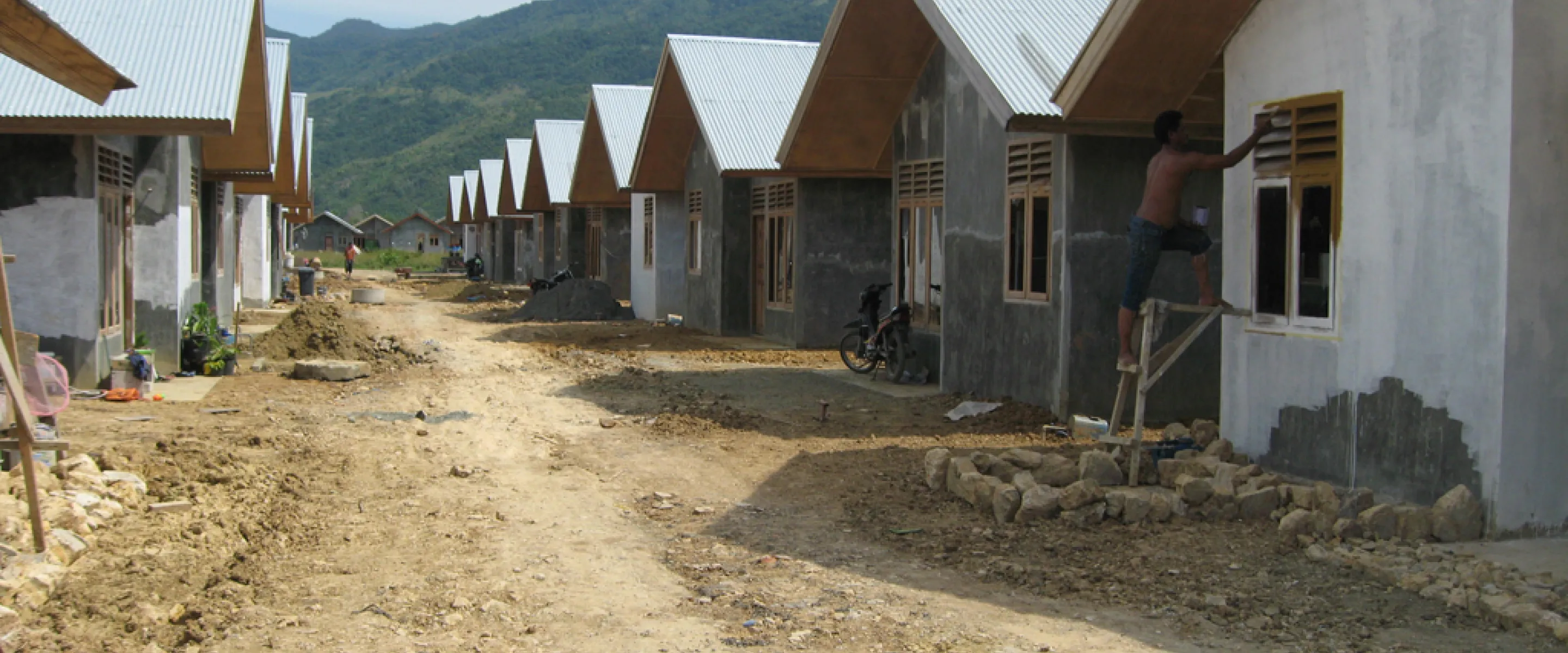 A row of houses in Indonesia that are being worked on.