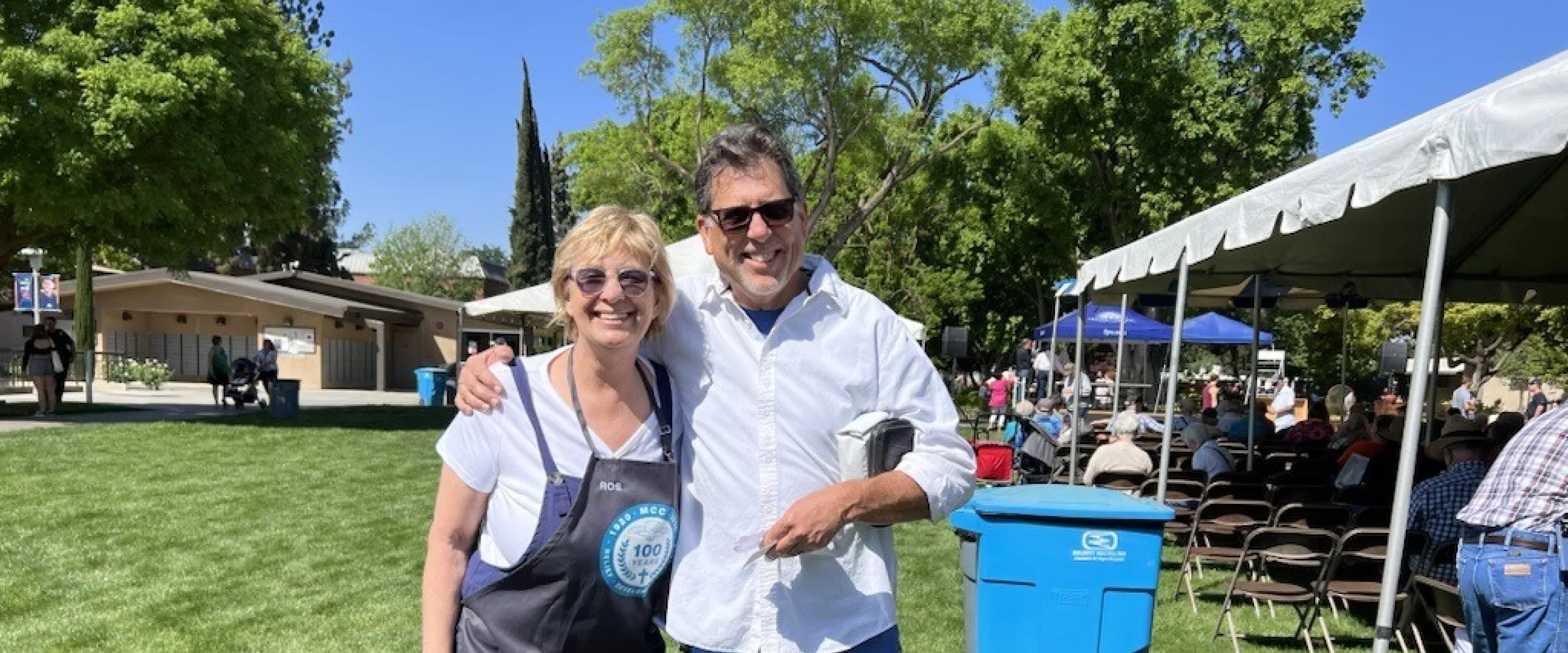 Two people smiling, posing for a photo