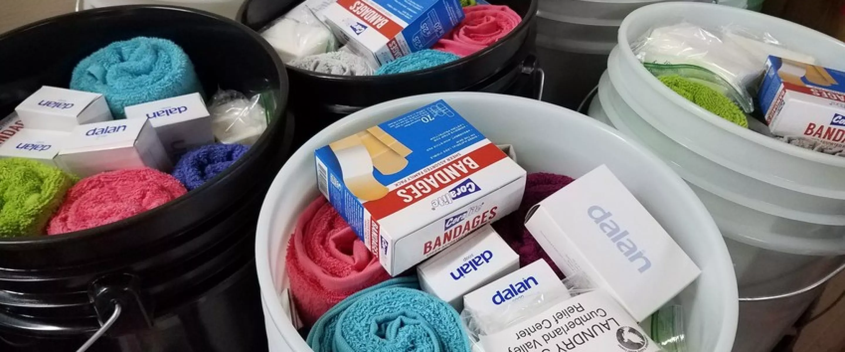 Relief kits await lids at the Material Resources Center in Ephrata, PA. Relief kits include:

	
		4 large bars bath soap 
	
		1 plastic bottle shampoo (13–24 oz; place in resealable plastic bag)