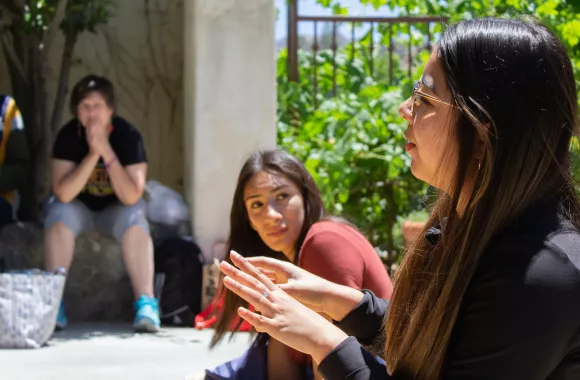 A woman speaking to another woman