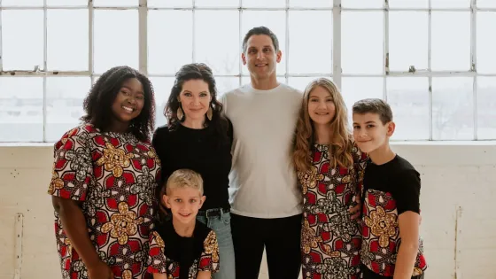 A family of six pose for a photo