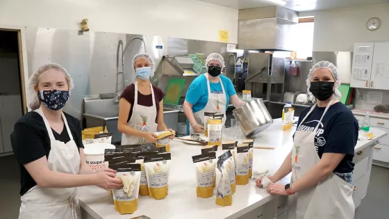 Four women working in a kitchen