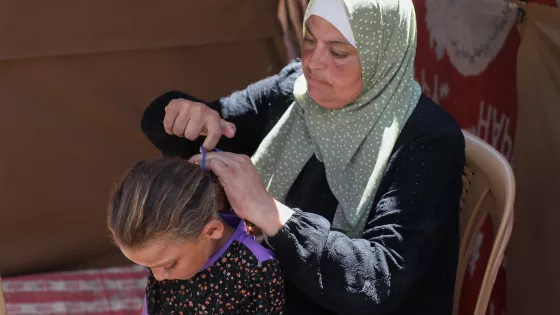 Woman combed child's hair