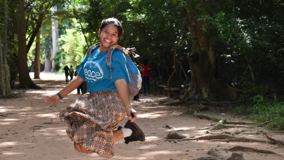 Young woman jumping into the air 